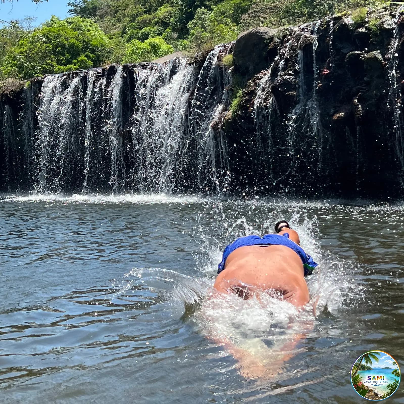 Swimming in a waterfall pool