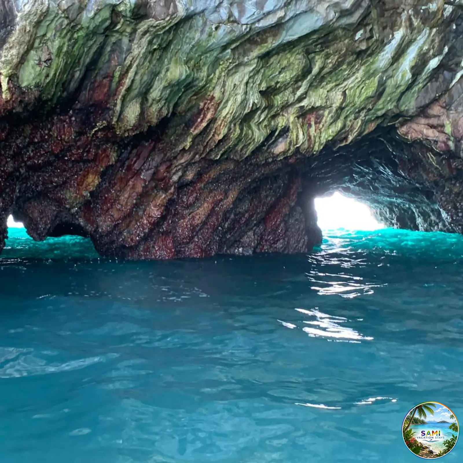 Turquoise sea under a natural cave arch